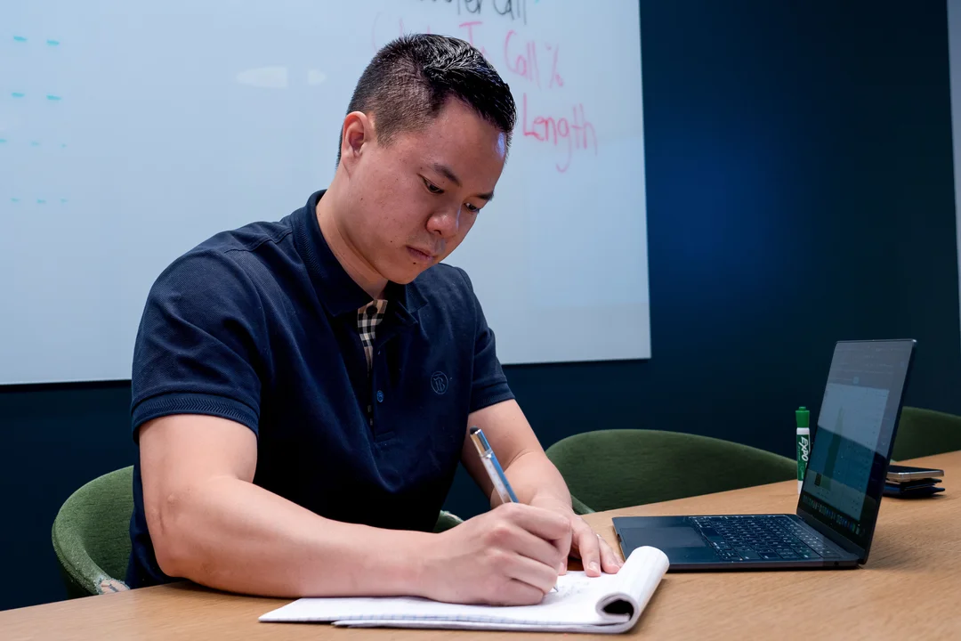 Ringba User Stories - Teddy Truong Writing on a Notepad